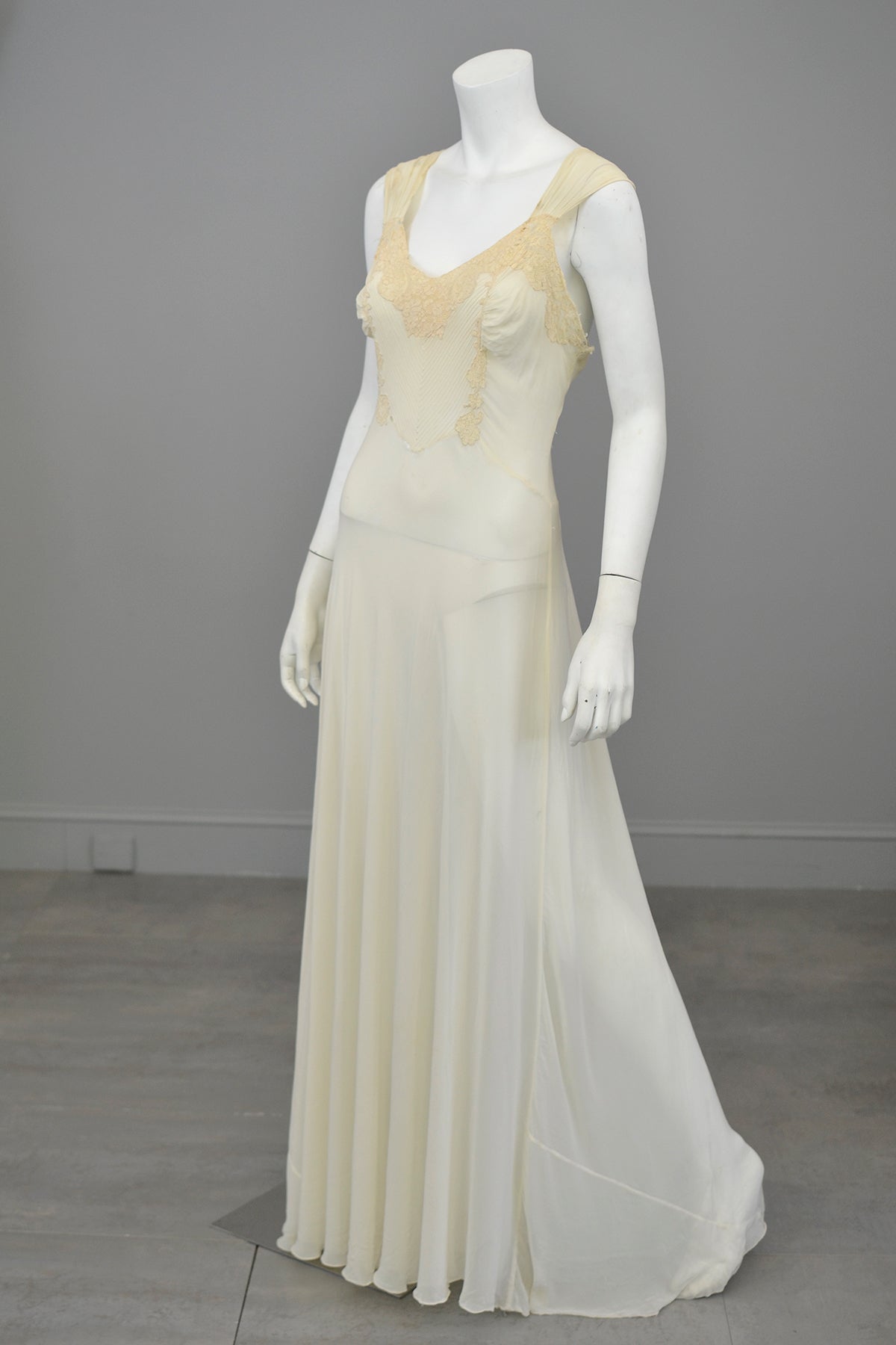 A 1930s sleeveless bias cut sequinned evening gown with plunge neckline.  Measures from back of neck